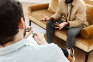 male therapist and client in therapy session