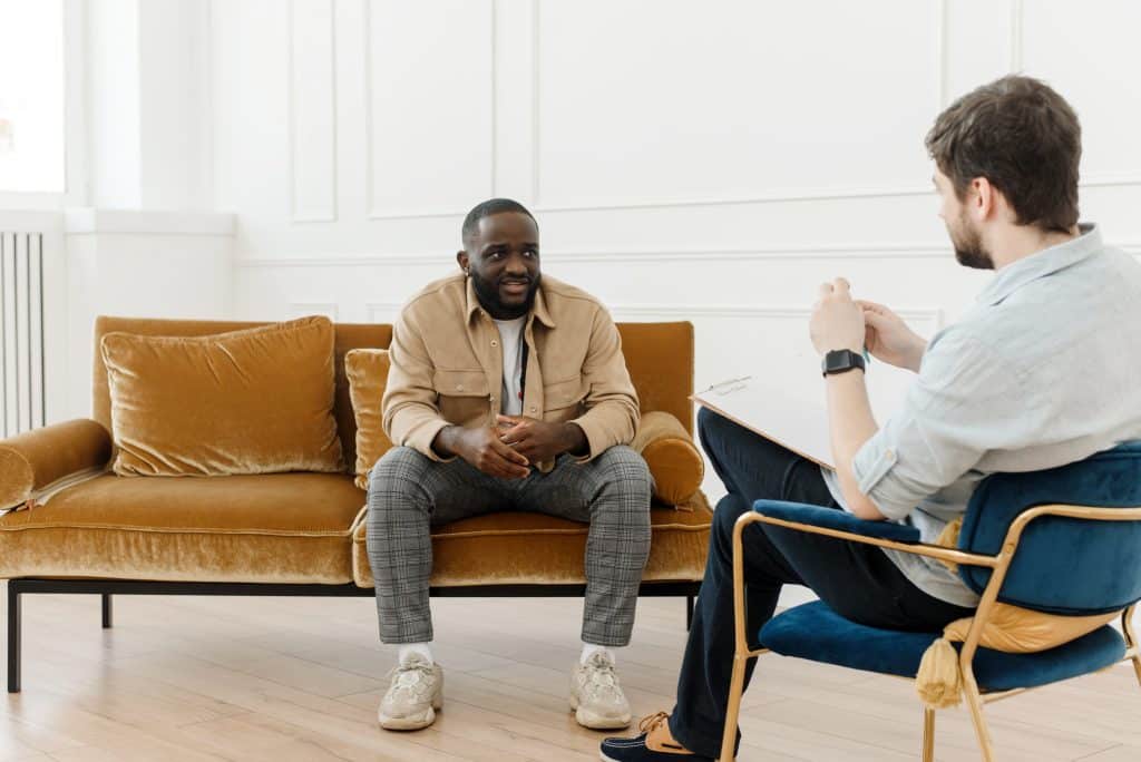 therapist and male client in therapy session
